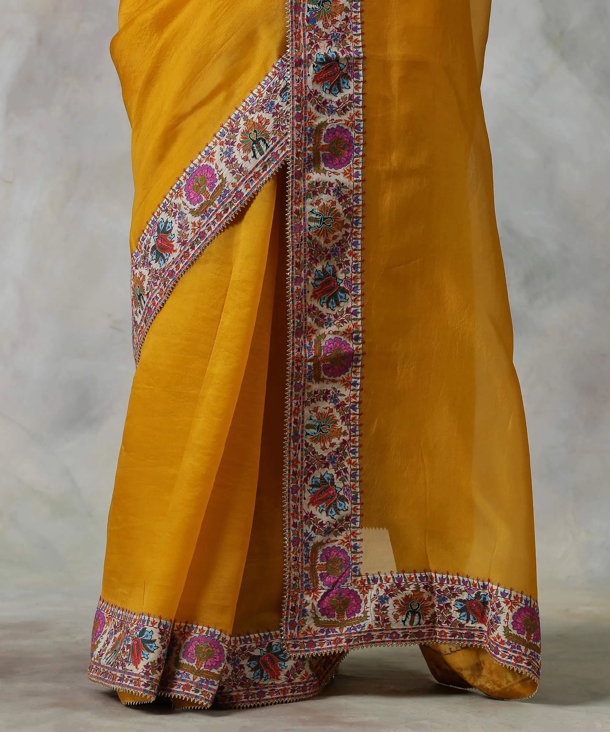 Mustard Handloom Organza Saree with Hand Appliqued Sozni Needle Work Border